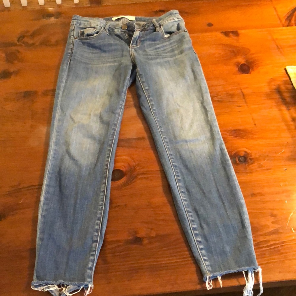 Jeans with distress at the hem